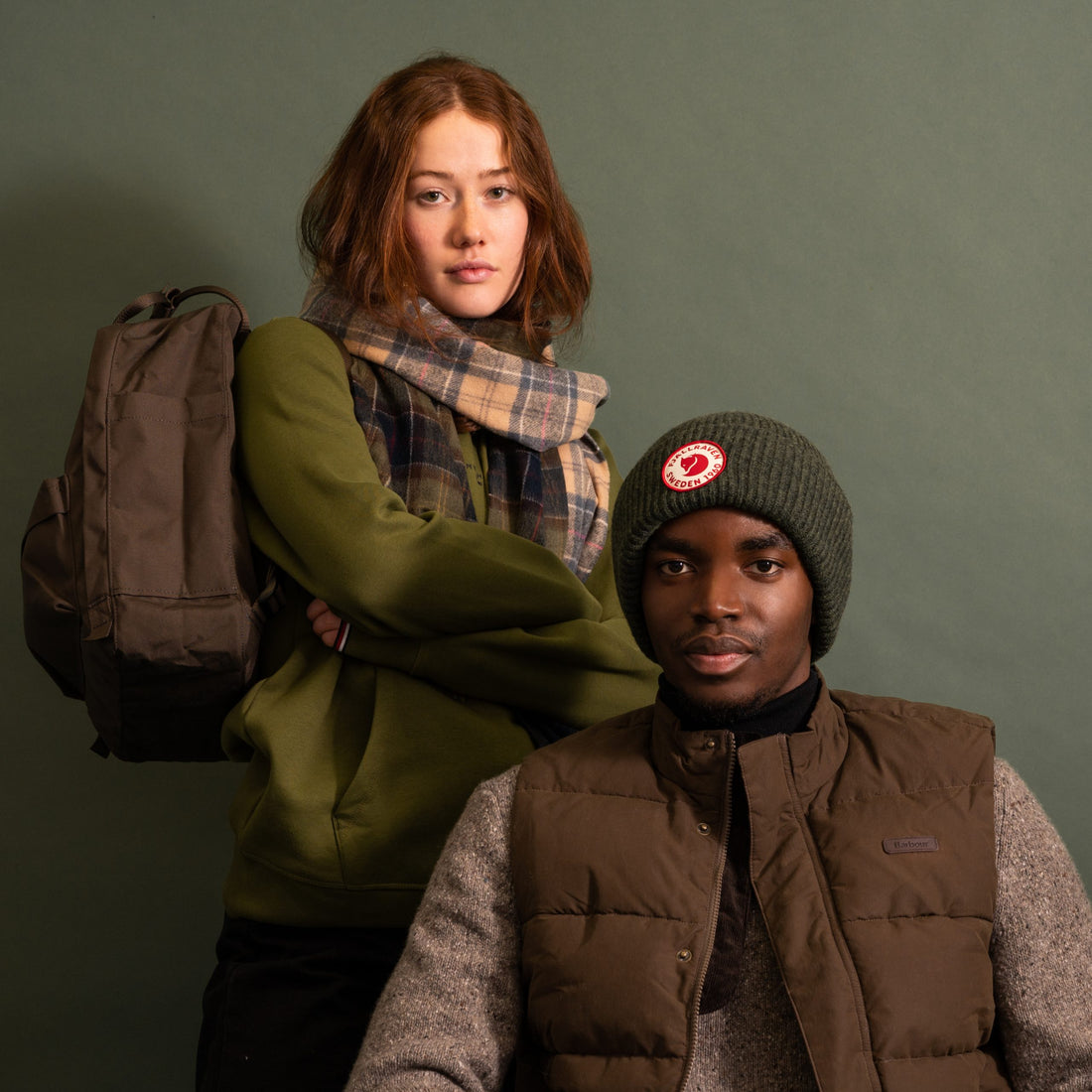 A man and woman wear stylish, neutral country clothing