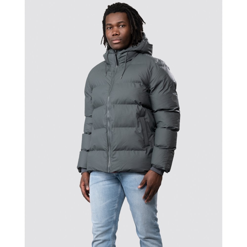 Man wearing a Rains puffer jacket