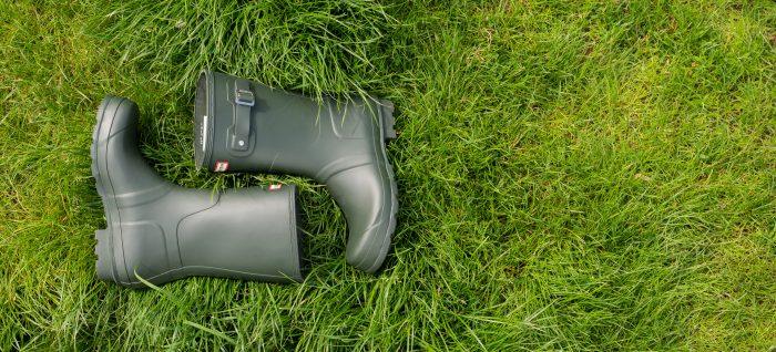 Hunter wellies lying in a field