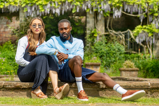 woman and man sat in the garden dresses in classic style fashion