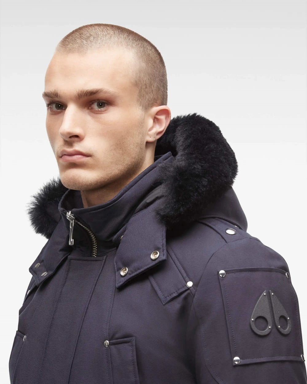 Close up of a man wearing a Moose Knuckles Parka