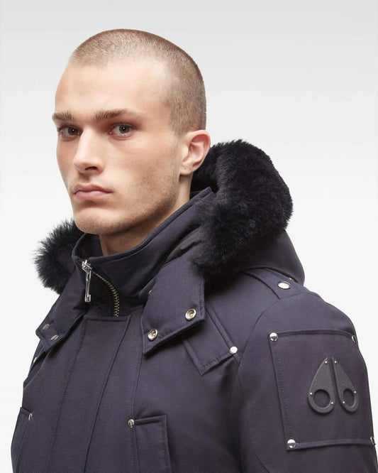 Close up of a man wearing a Moose Knuckles Parka