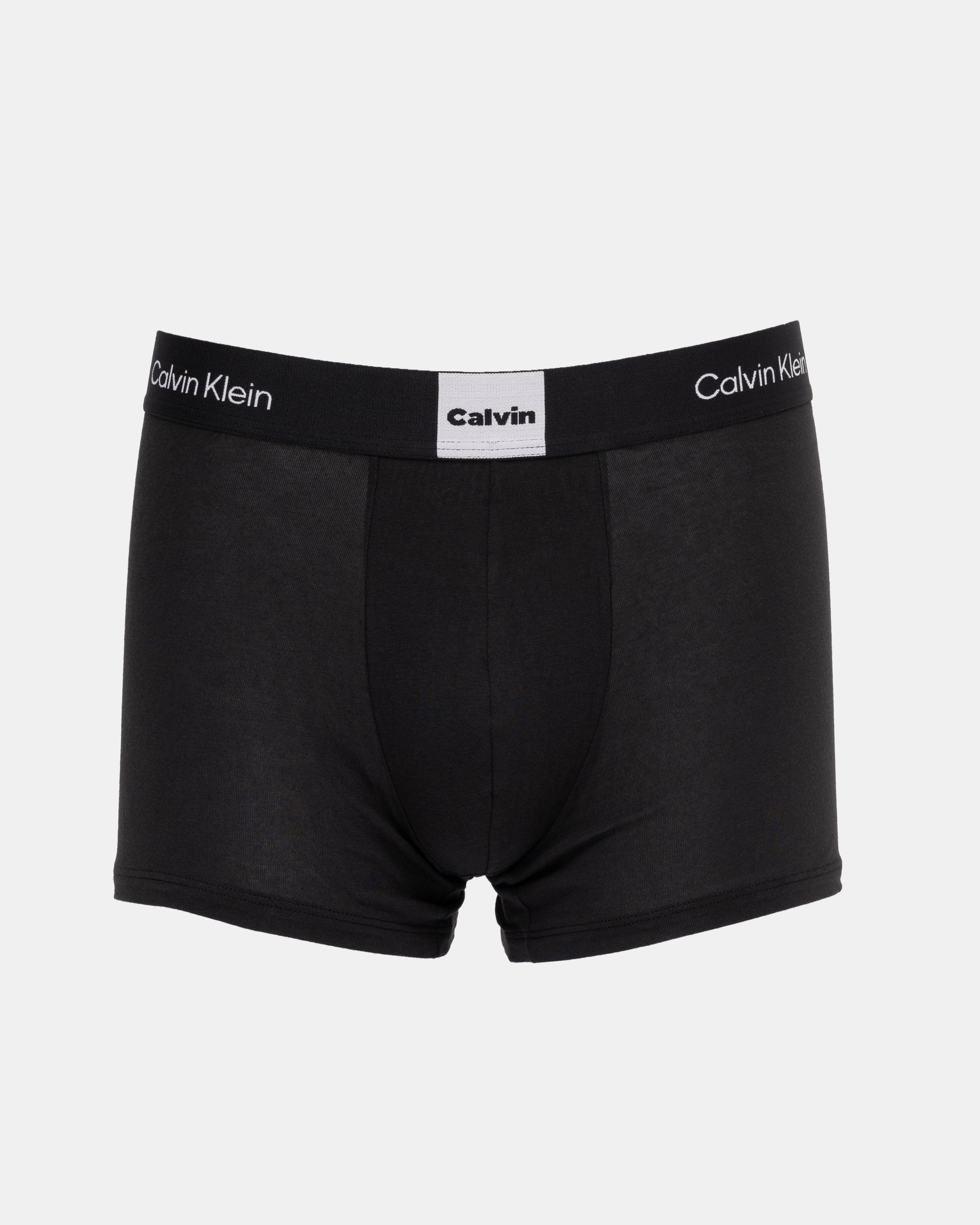 Black Calvin Klein boxer briefs on a light gray background