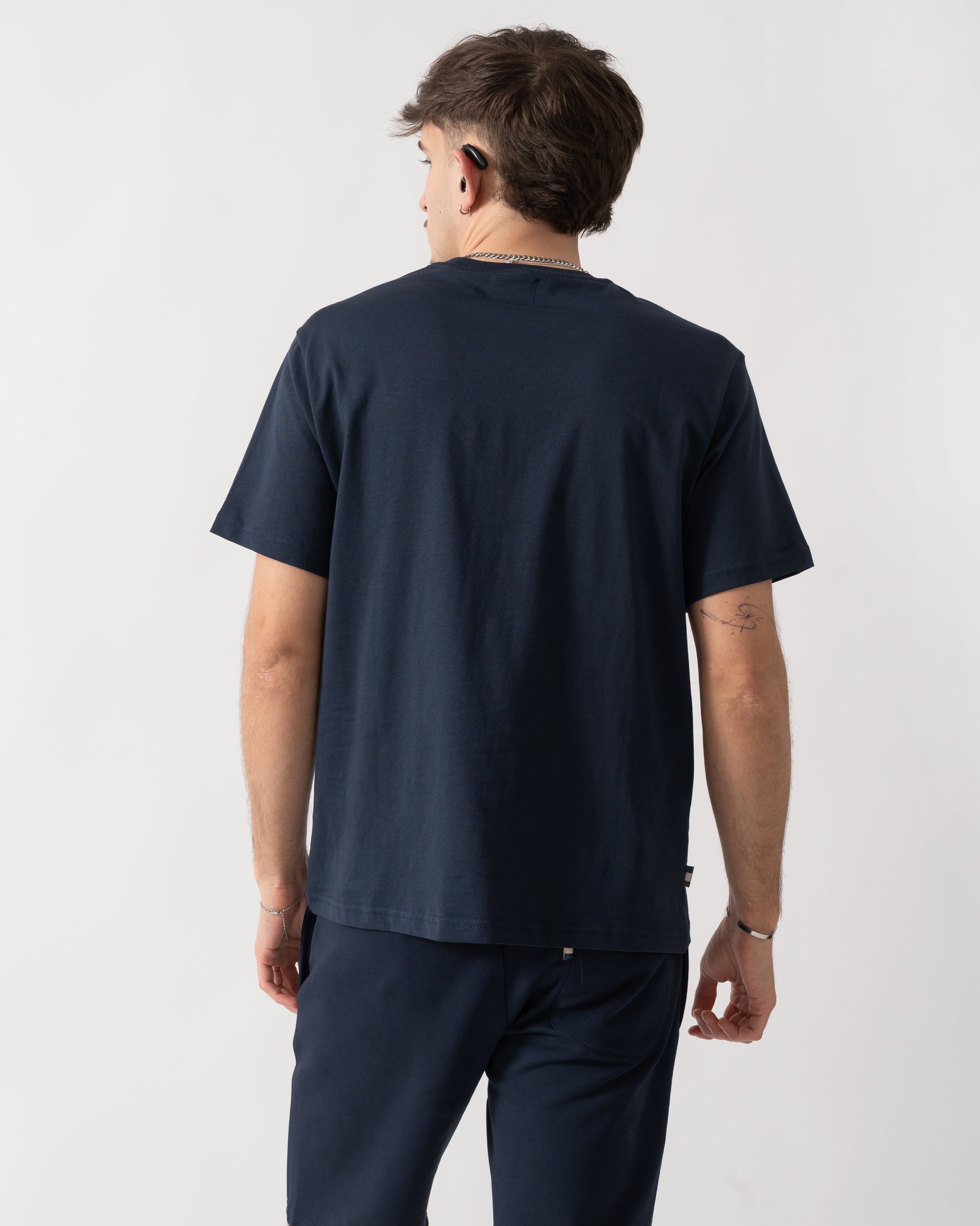 back shot of a model wearing an Aquascutum Mens Badge T-Shirt in Navy 11