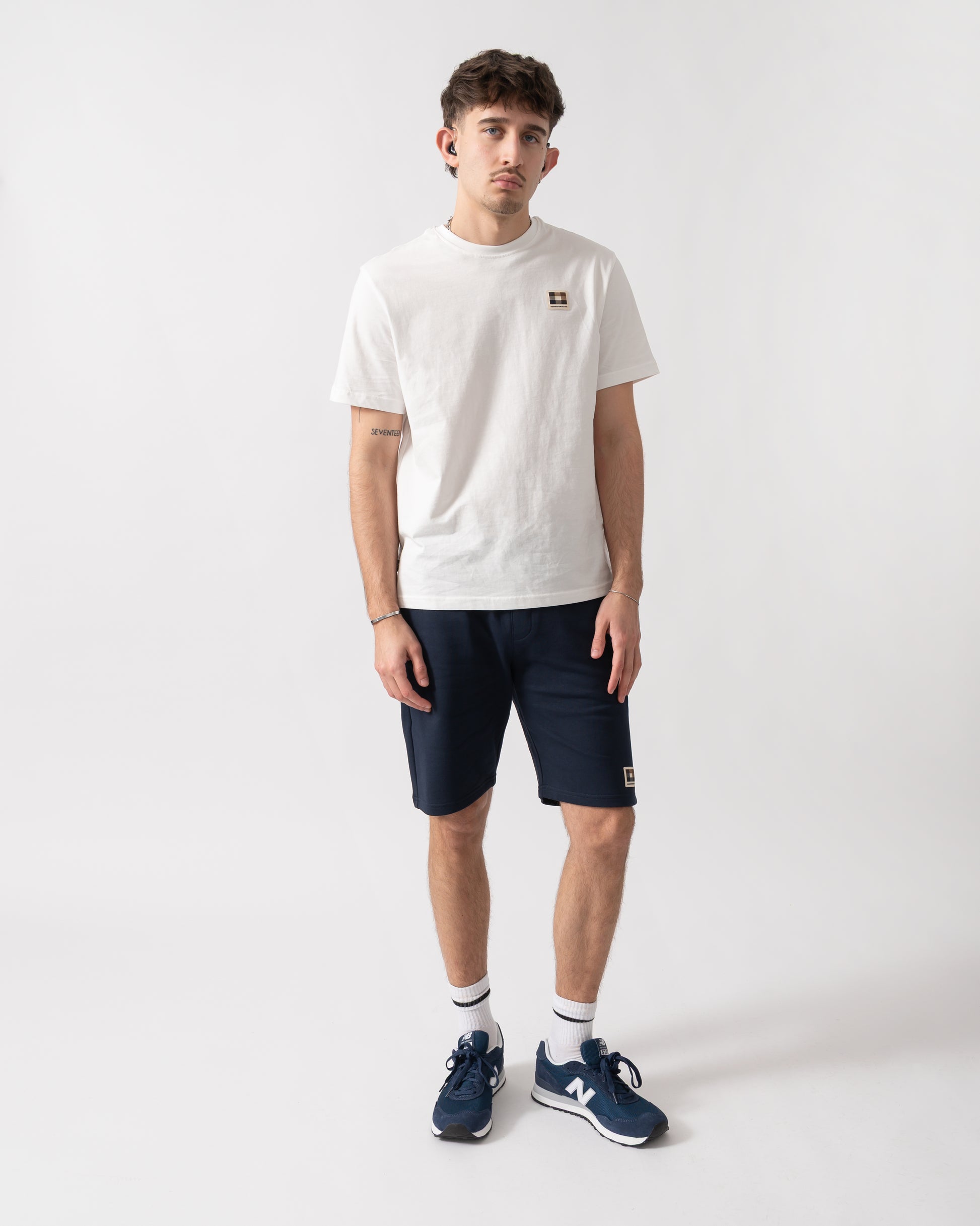 full length shot of a model wearing an Aquascutum Mens Badge T-Shirt in Old White