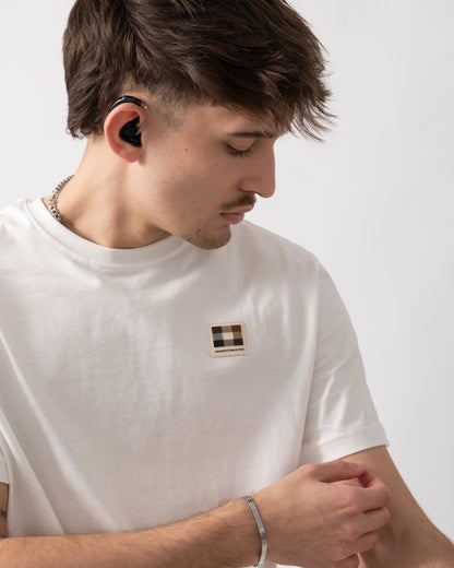 close up shot of a model wearing an Aquascutum Mens Badge T-Shirt in Old White