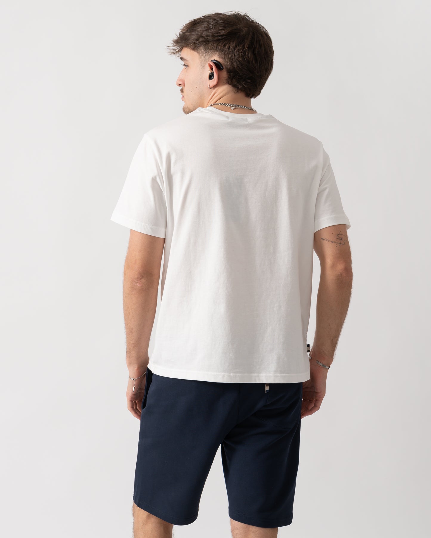 back shot of a model wearing an Aquascutum Mens Badge T-Shirt in Old White
