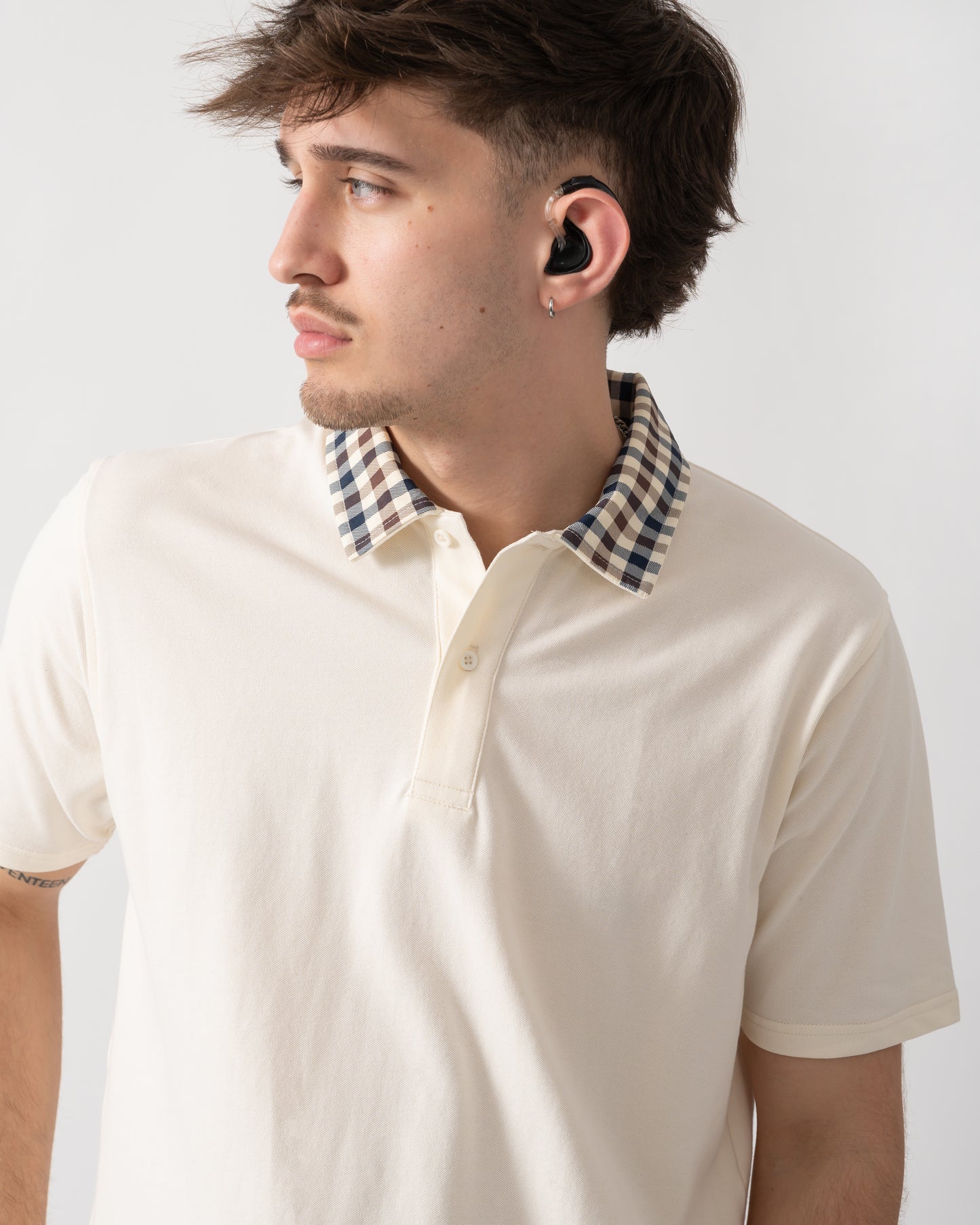 close up shot of model wearing an Aquascutum Mens Club Check Collar Polo Shirt in Old White 02