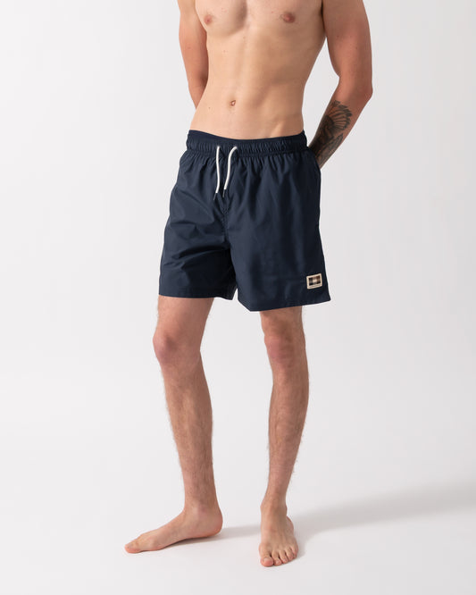 model wearing a pair of Aquascutum Mens Club Check Pocket Beach Shorts in Navy 11