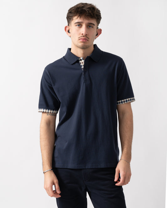 studio shot of a model wearing an Aquascutum Mens Club Check Stretch Piquet Sleeves Polo Shirt in Navy 11