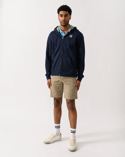 full length shot of a model wearing an Aquascutum Mens Full Zip Badge Hoodie in Navy