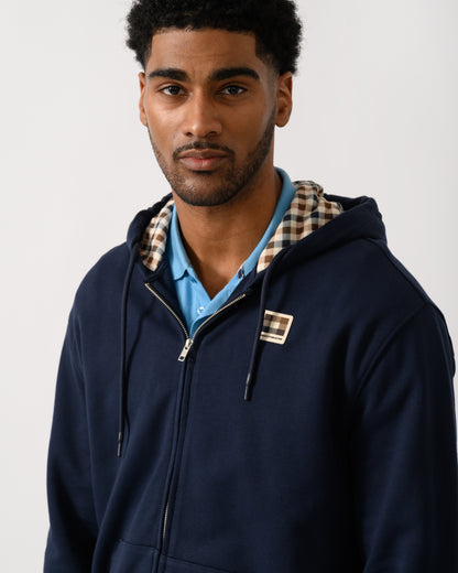 detail view of a model wearing an Aquascutum Mens Full Zip Badge Hoodie in Navy