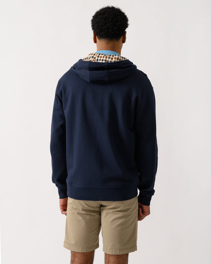 rear view of a model wearing an Aquascutum Mens Full Zip Badge Hoodie in Navy
