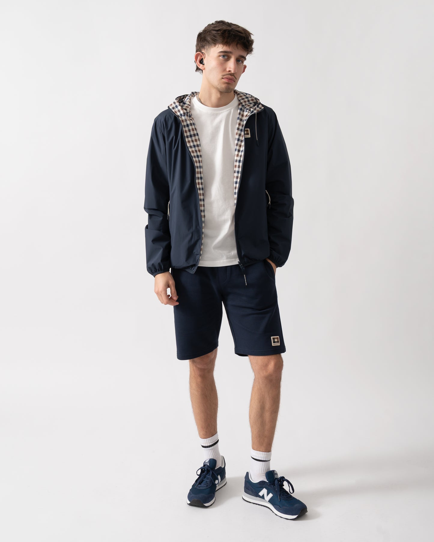 full length studio shot of a model wearing an Aquascutum Mens RLG Badge Reversible Sailor Jacket in Navy 11