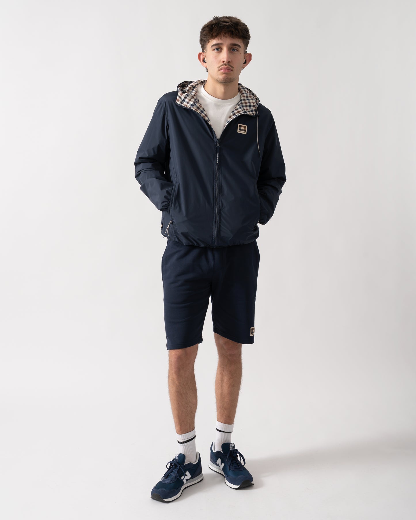 full length shot of a model wearing an Aquascutum Mens RLG Badge Reversible Sailor Jacket in Navy 11