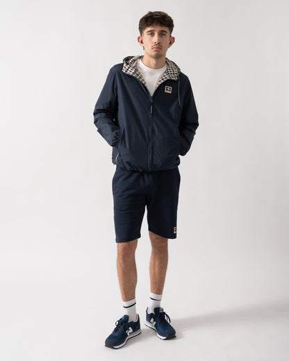 full length shot of a model wearing an Aquascutum Mens RLG Badge Reversible Sailor Jacket in Navy 11
