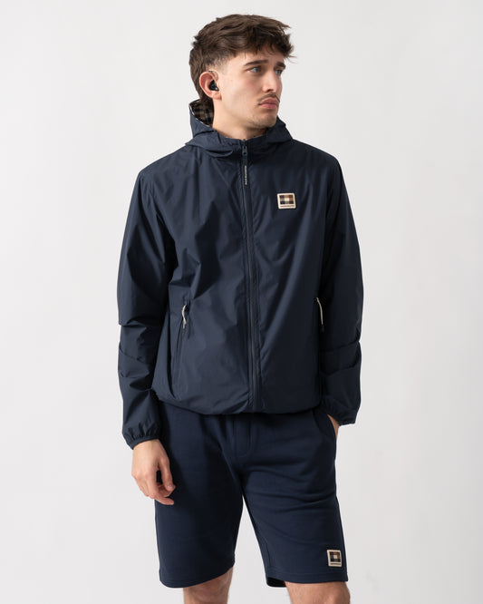 studio shot of a model wearing an Aquascutum Mens RLG Badge Reversible Sailor Jacket in Navy 11