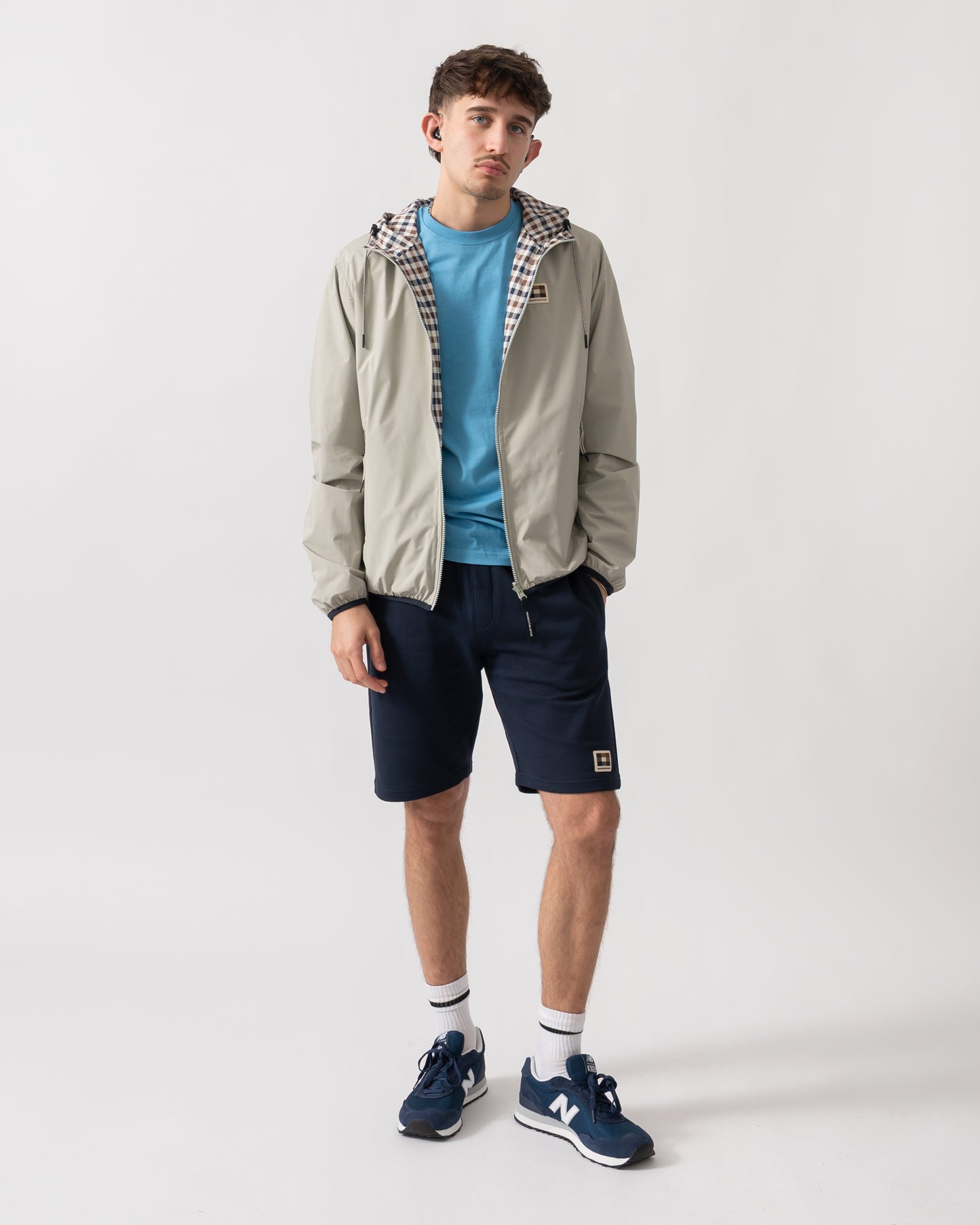 full length shot of a model wearing an Aquascutum Mens RLG Badge Reversible Sailor Jacket in Salvia 34
