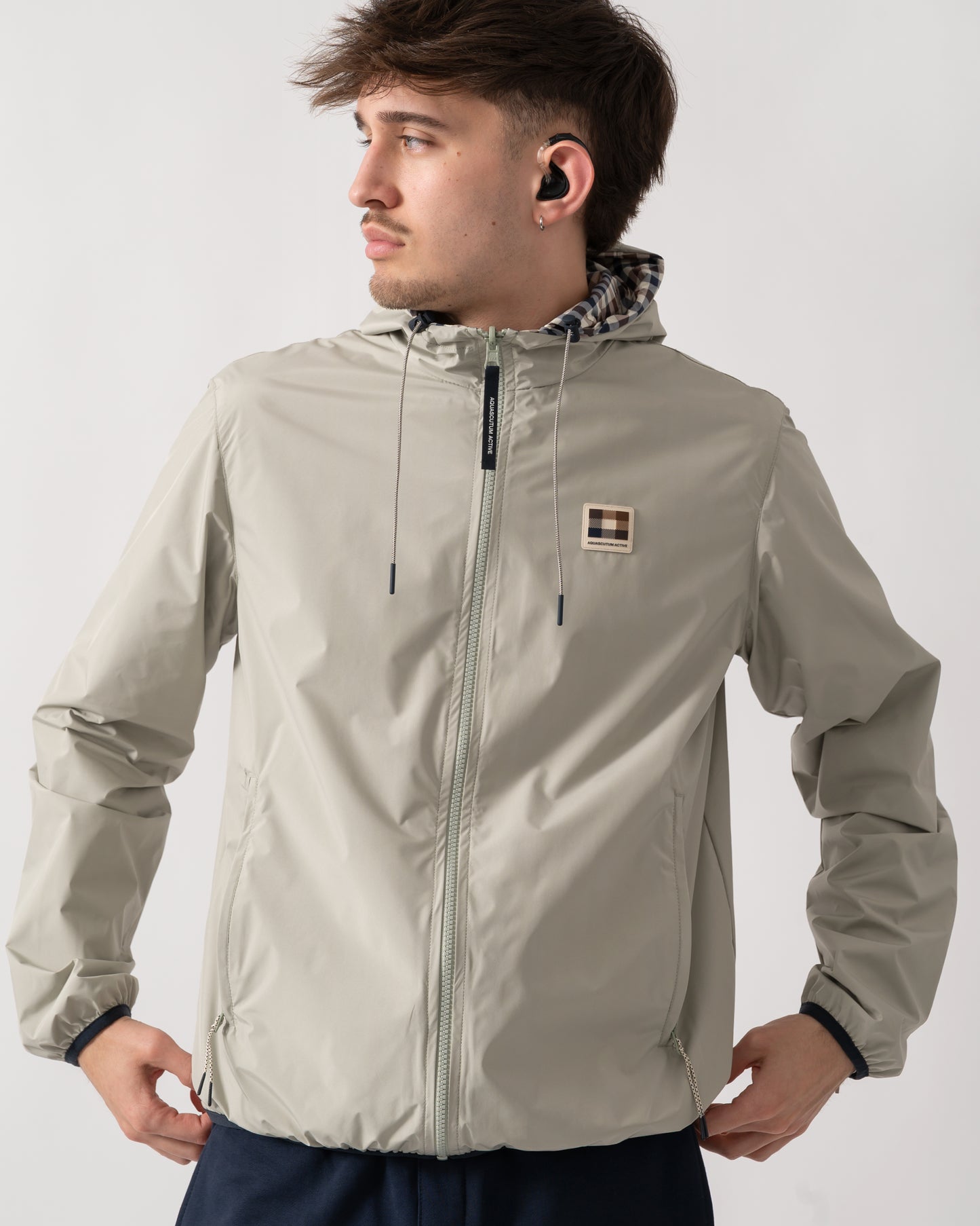 detail shot of a model wearing an Aquascutum Mens RLG Badge Reversible Sailor Jacket in Salvia 34