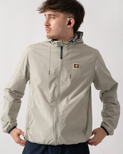 detail shot of a model wearing an Aquascutum Mens RLG Badge Reversible Sailor Jacket in Salvia 34