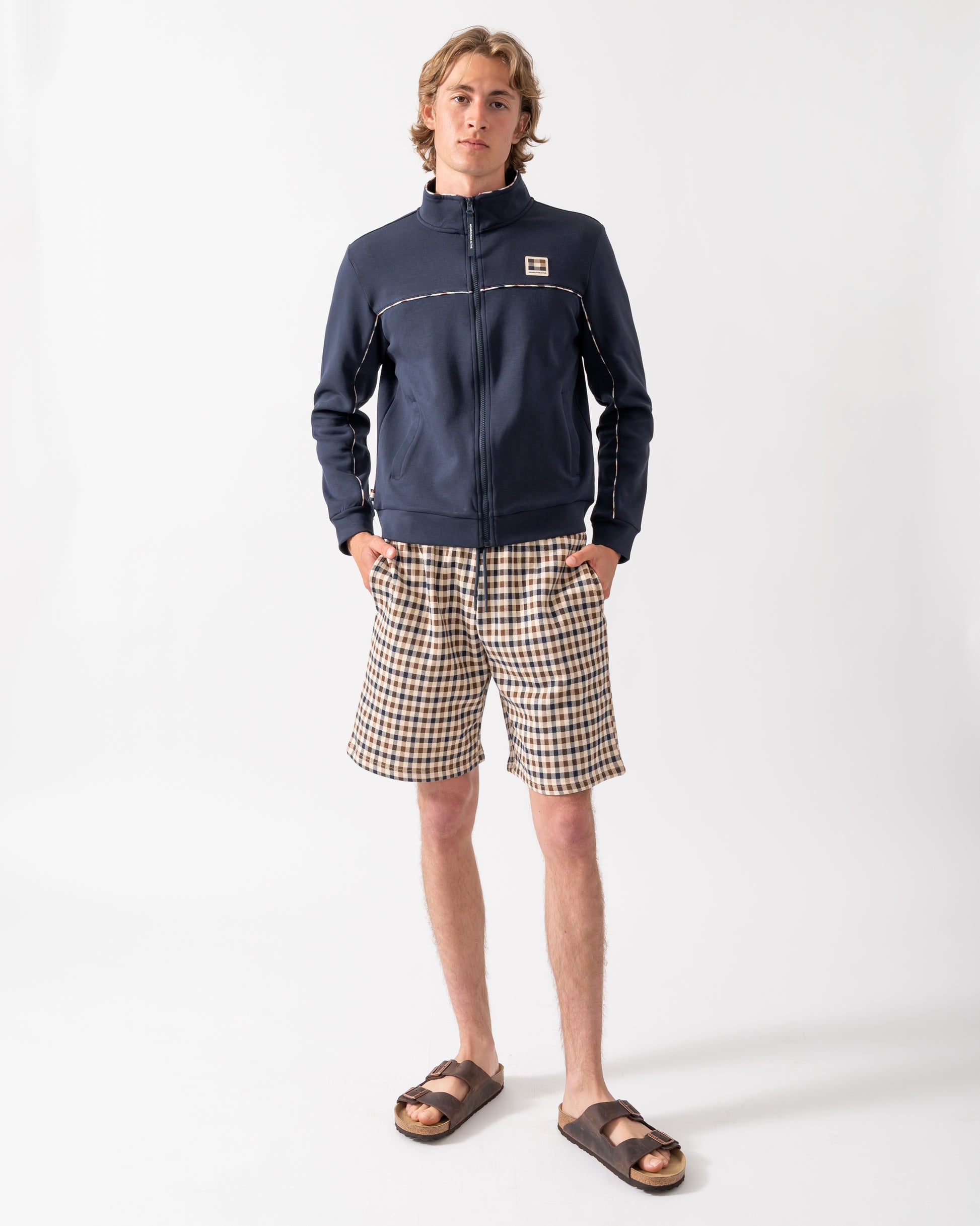 full lenghth shot of a model wearing Aquascutum Mens Scuba Piping Track Top in Navy 11