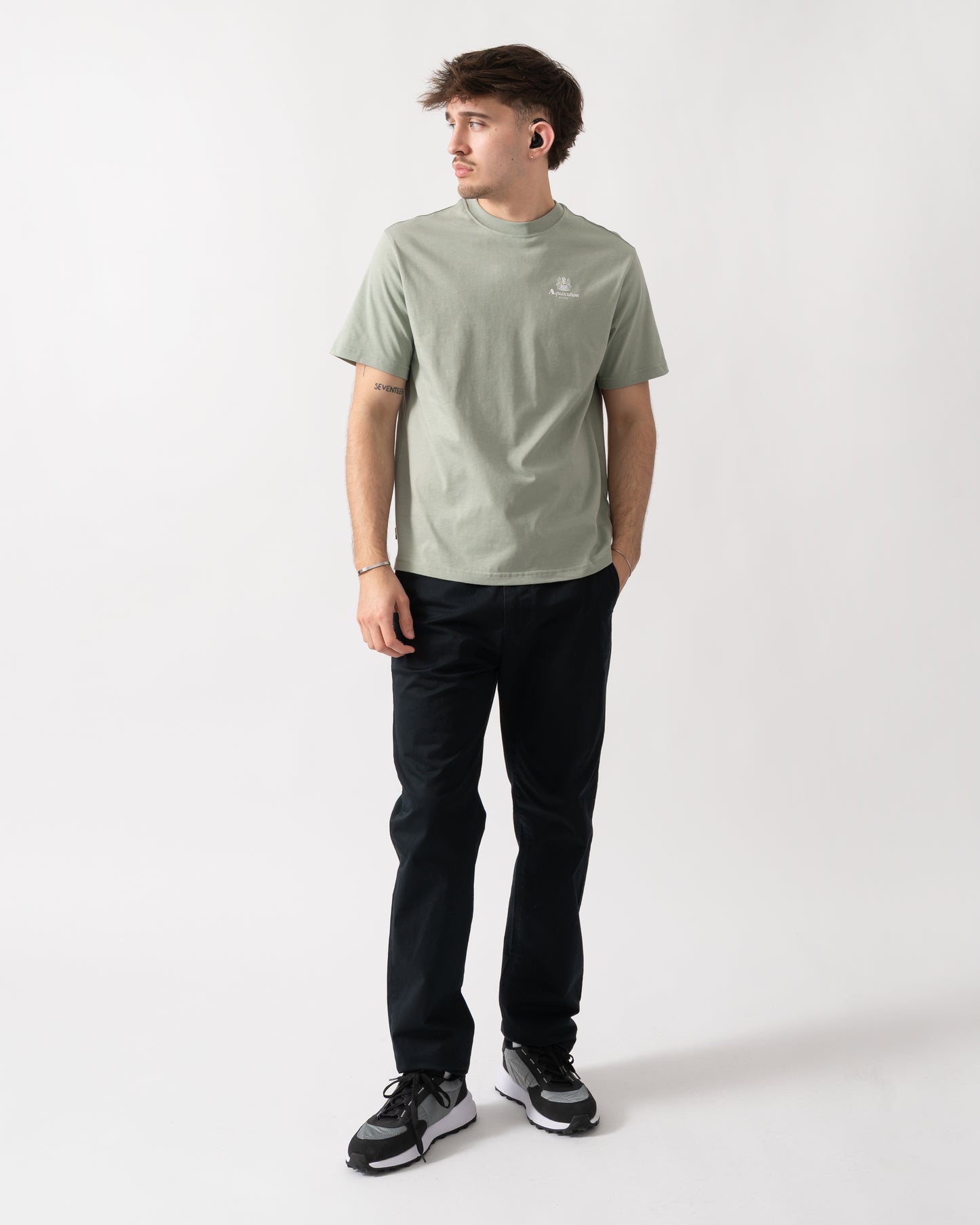 full length shot of a model wearing a Aquascutum Mens Small Logo T-Shirt in Salvia 34