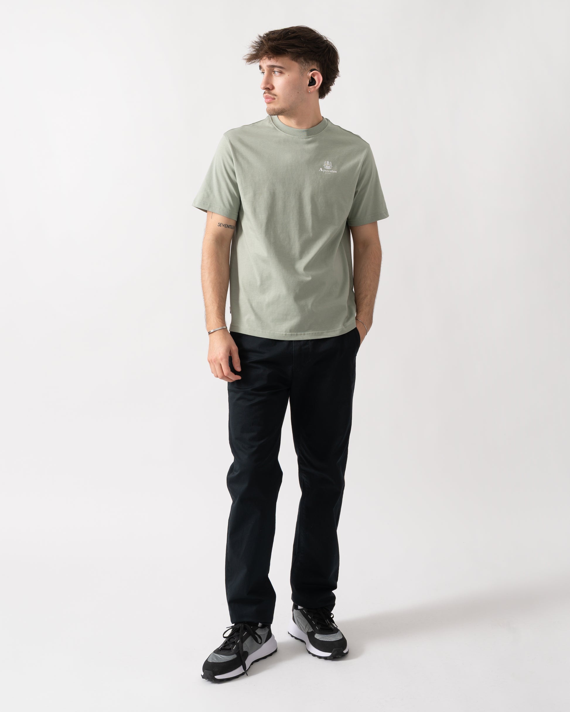 full length shot of a model wearing a Aquascutum Mens Small Logo T-Shirt in Salvia 34