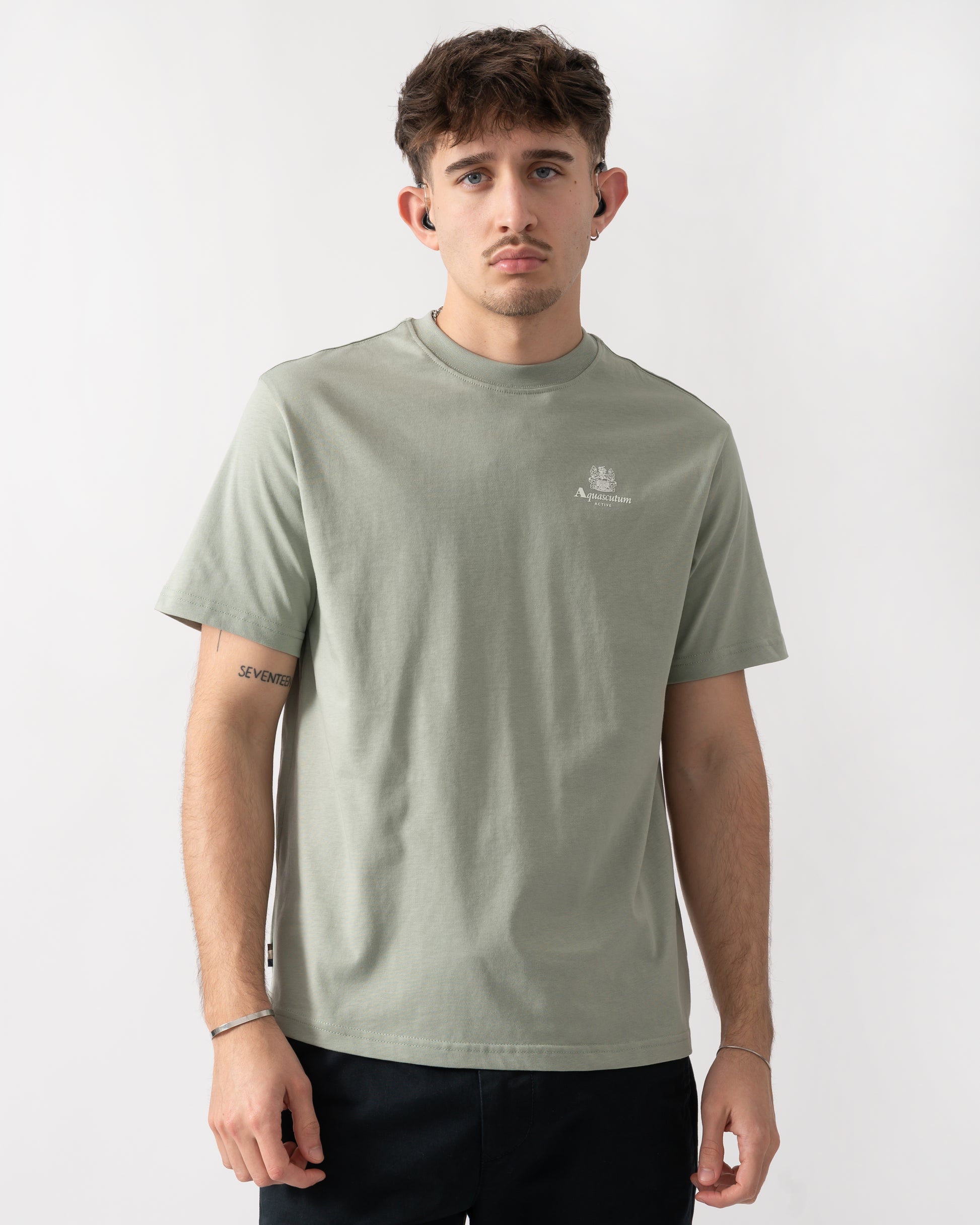 Studio shot of a model wearing a Aquascutum Mens Small Logo T-Shirt in Salvia 34