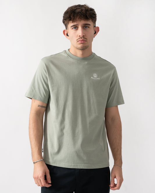 Studio shot of a model wearing a Aquascutum Mens Small Logo T-Shirt in Salvia 34