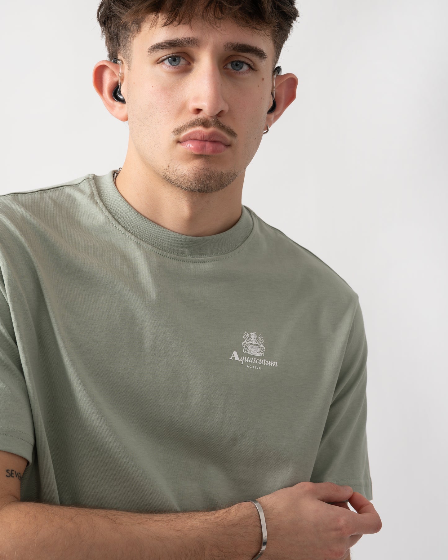 close up shot of a model wearing a Aquascutum Mens Small Logo T-Shirt in Salvia 34