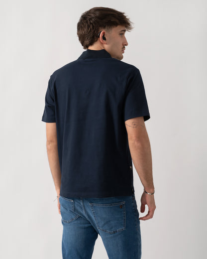 back shot of a model wearing an Aquascutum Mens Stretch Piquet Badge Polo Shirt in Navy 11