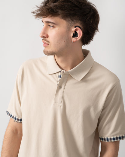 close up shot of a model wearing an Aquascutum Mens Club Check Stretch Piquet Sleeves Polo Shirt in Beige 03