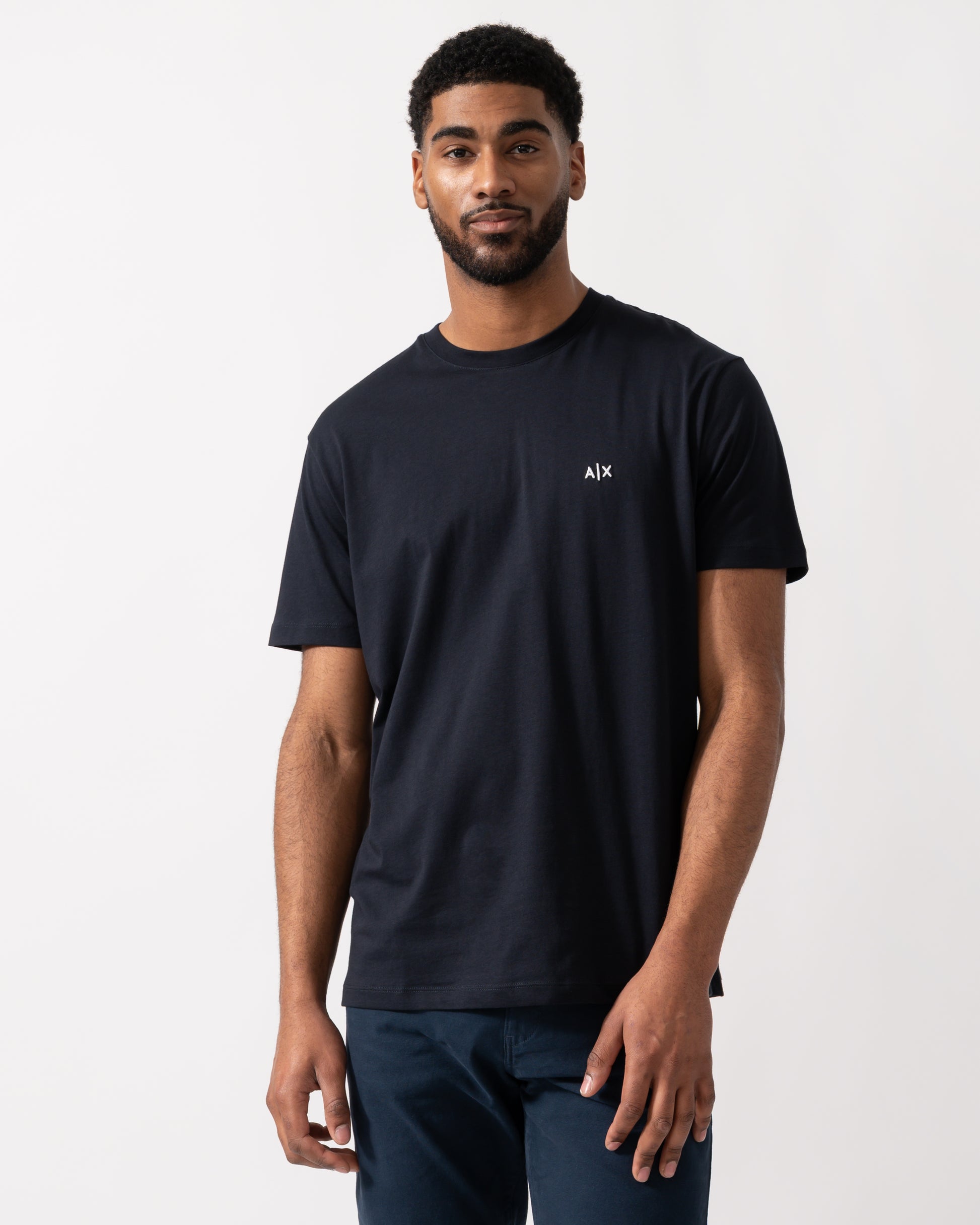 Model wearing an Armani Exchange Mens A|X Monogram T-Shirt in Deep Navy
