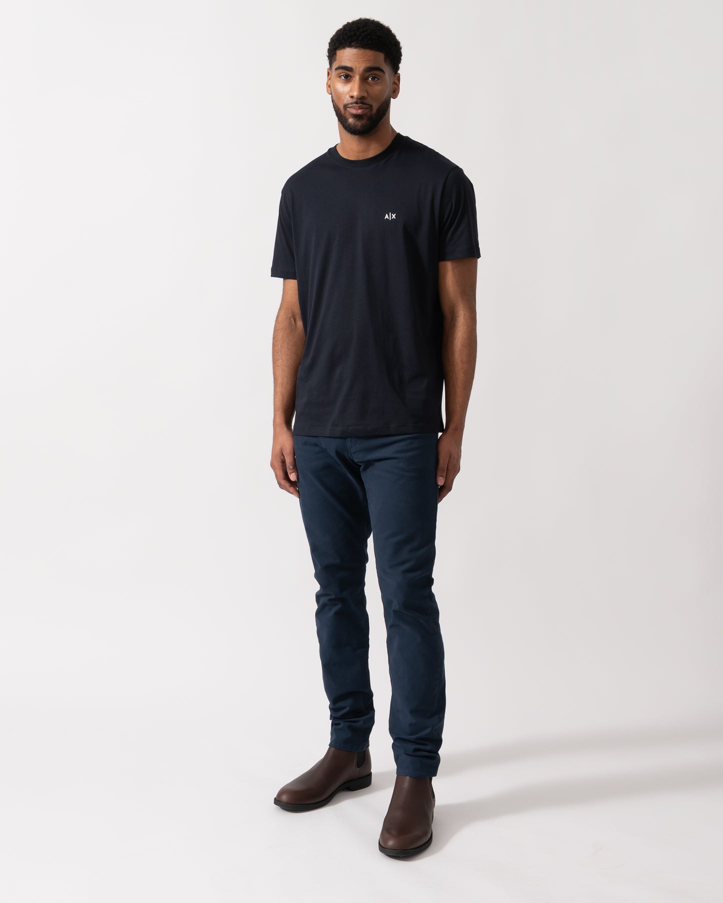 Full length shot of a model wearing an Armani Exchange Mens A|X Monogram T-Shirt in Deep Navy