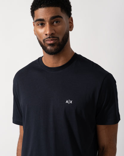 detail shot of a model wearing an Armani Exchange Mens A|X Monogram T-Shirt in Deep Navy