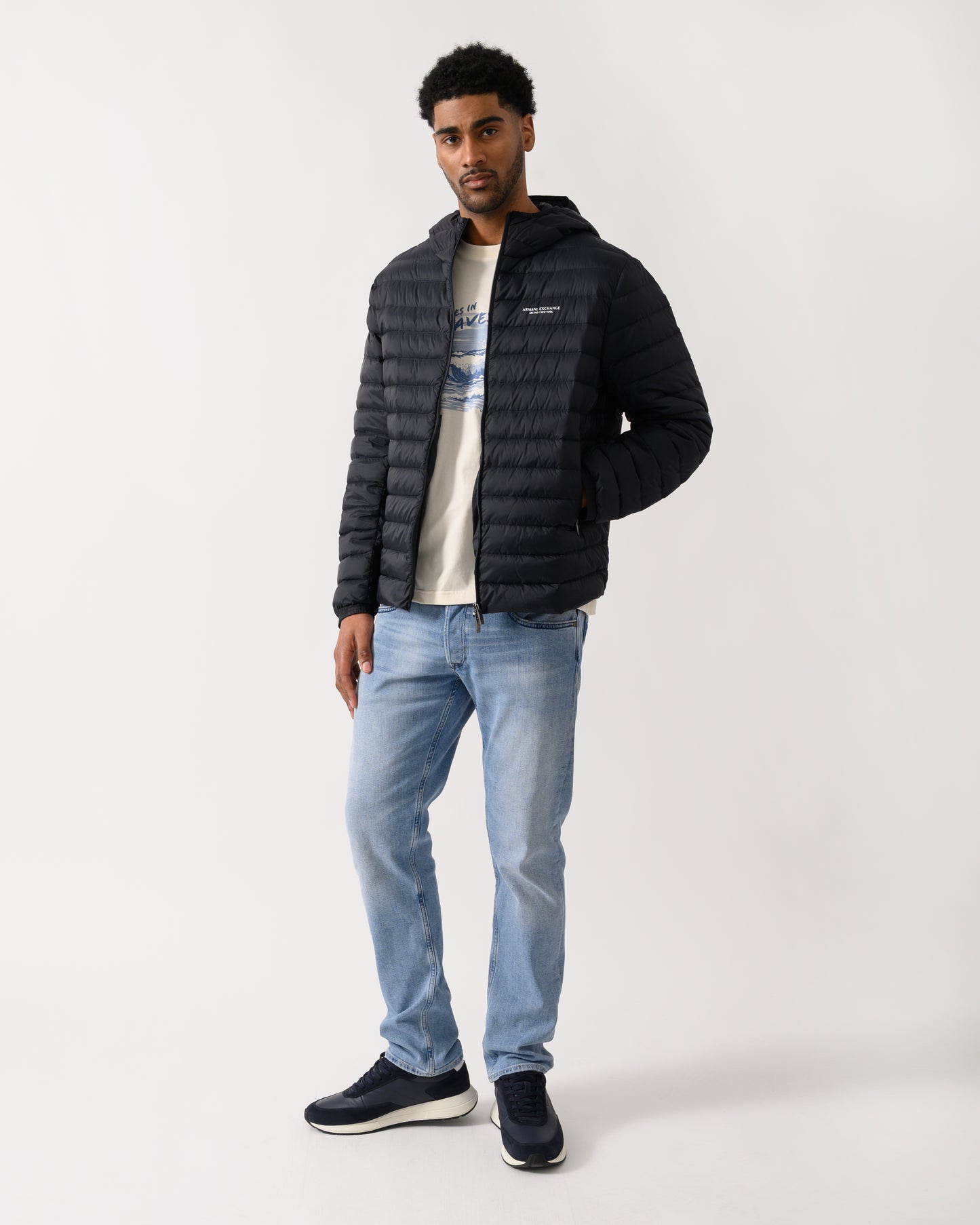 full length shot of a model wearing a Armani Exchange Mens Down Jacket XM001577-AF16927 in Deep Navy UB101