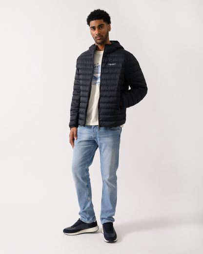 full length shot of a model wearing a Armani Exchange Mens Down Jacket XM001577-AF16927 in Deep Navy UB101