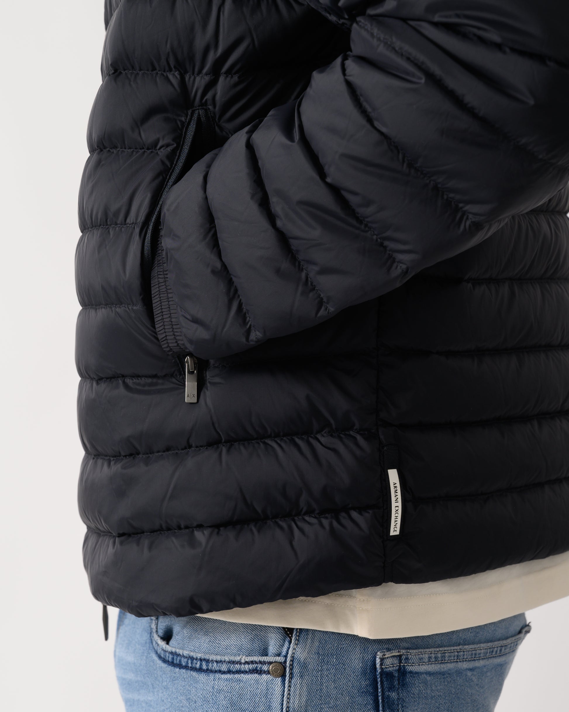 detail shot of a model wearing a Armani Exchange Mens Down Jacket XM001577-AF16927 in Deep Navy UB101