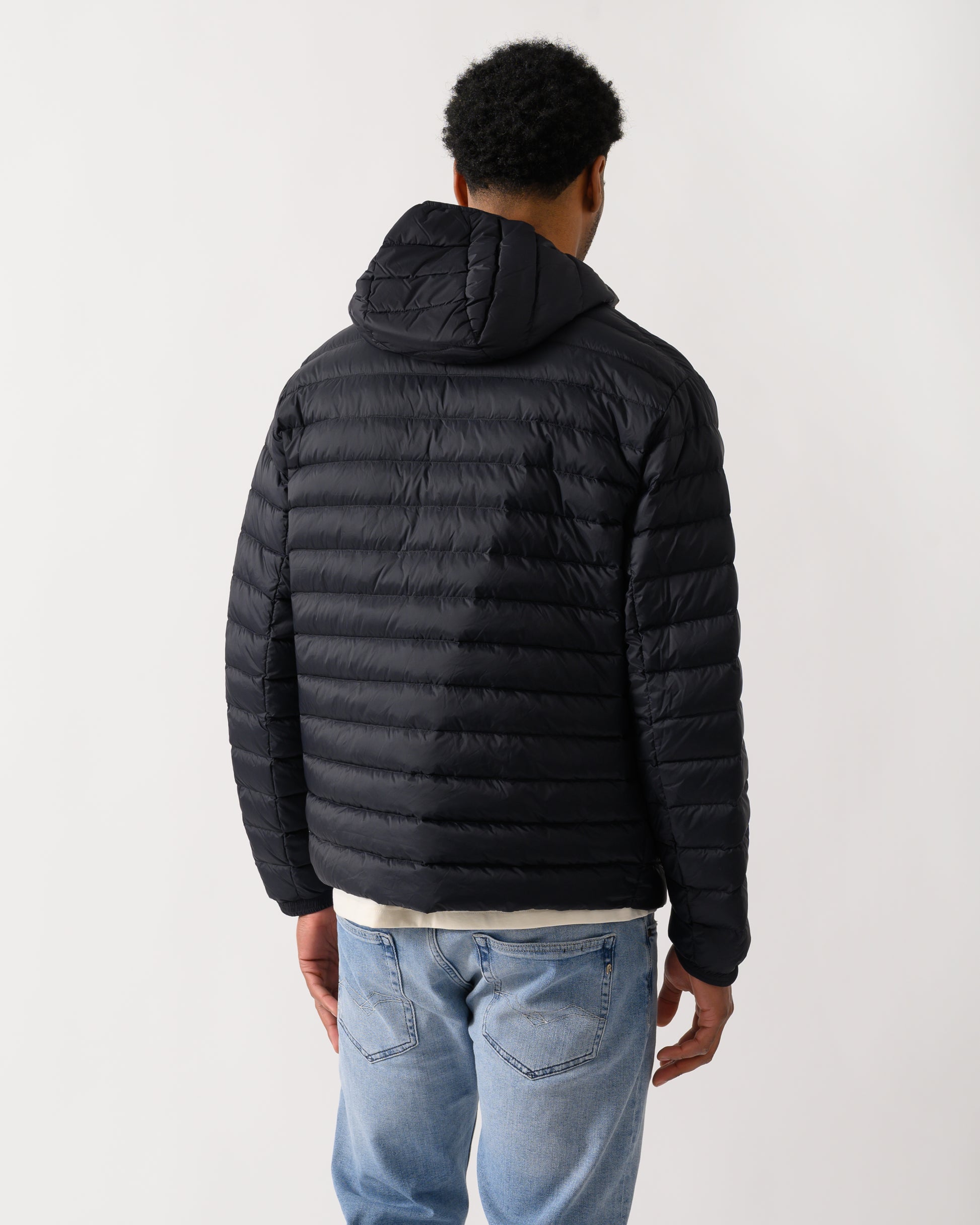 back shot of a model wearing a Armani Exchange Mens Down Jacket XM001577-AF16927 in Deep Navy UB101
