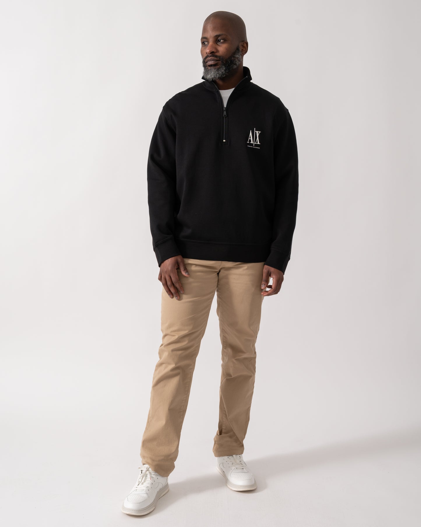 Full length shot of a model wearing an Armani Exchange Mens Embroidered A|X Logo 1/4 Zip Sweatshirt in Black