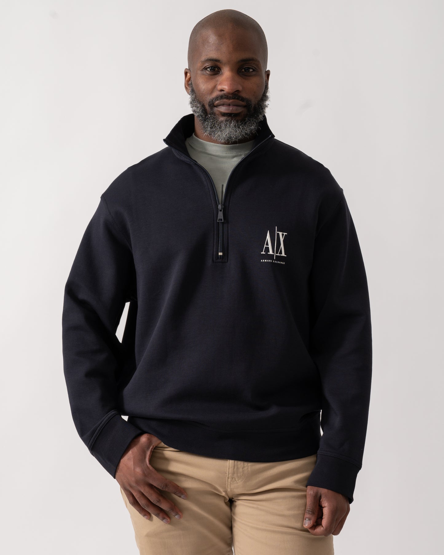 Model wearing an Armani Exchange Mens Embroidered A|X Logo 1/4 Zip Sweatshirt in Deep Navy