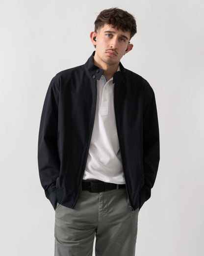 studio shot of a model wearing an Armani Exchange Mens Jacket XM002139-AF22536 in Deep Navy UB101