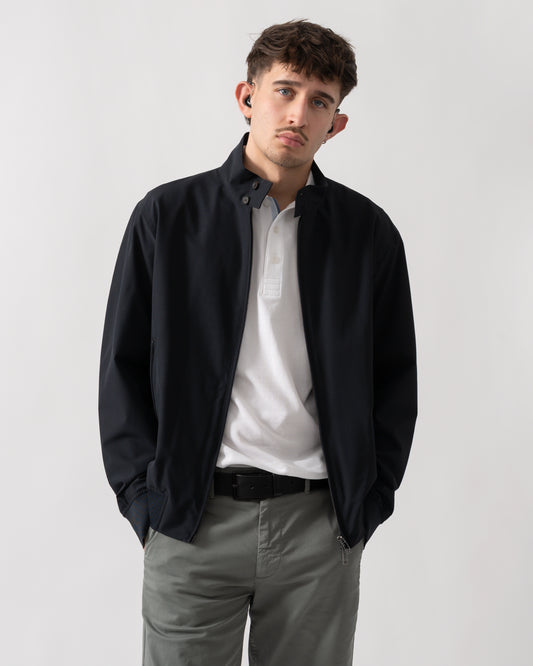 studio shot of a model wearing an Armani Exchange Mens Jacket XM002139-AF22536 in Deep Navy UB101