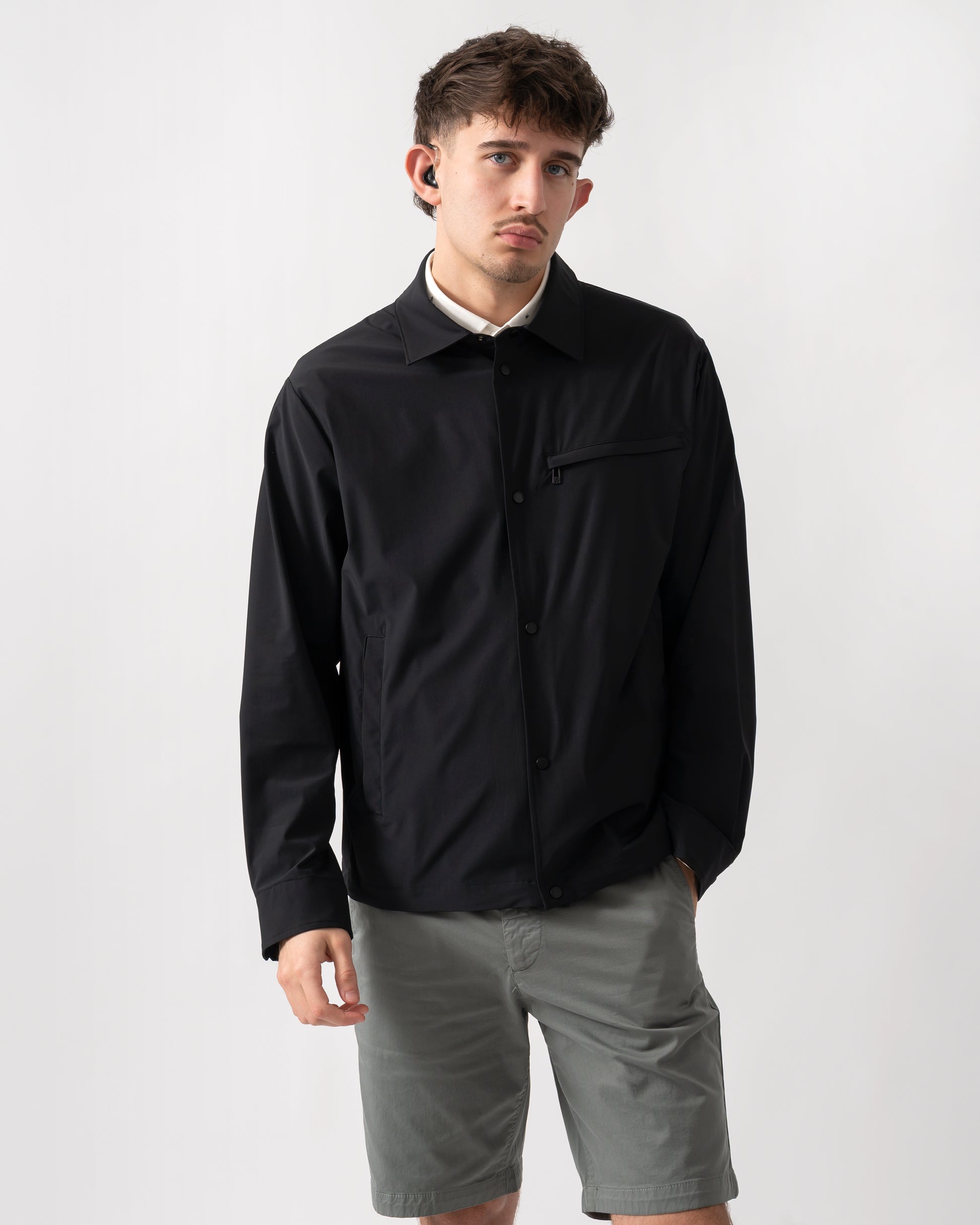 studio shot of a model wearing an Armani Exchange Mens Jacket XM002818-AF22572 in Black UC001