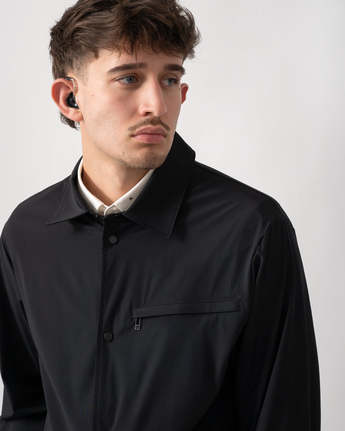 close up shot of a model wearing an Armani Exchange Mens Jacket XM002818-AF22572 in Black UC001