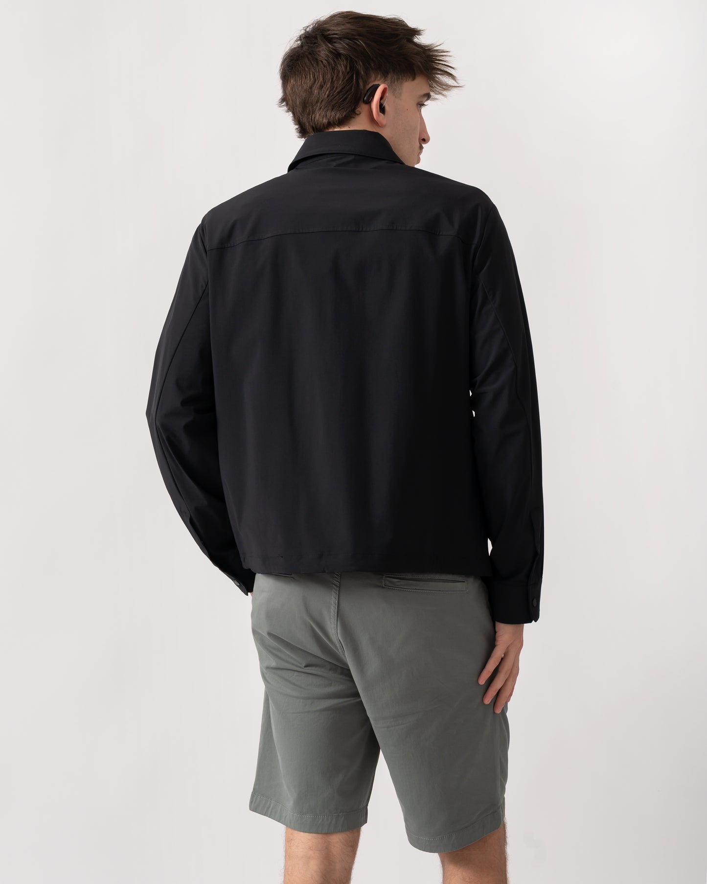 back shot of a model wearing an Armani Exchange Mens Jacket XM002818-AF22572 in Black UC001