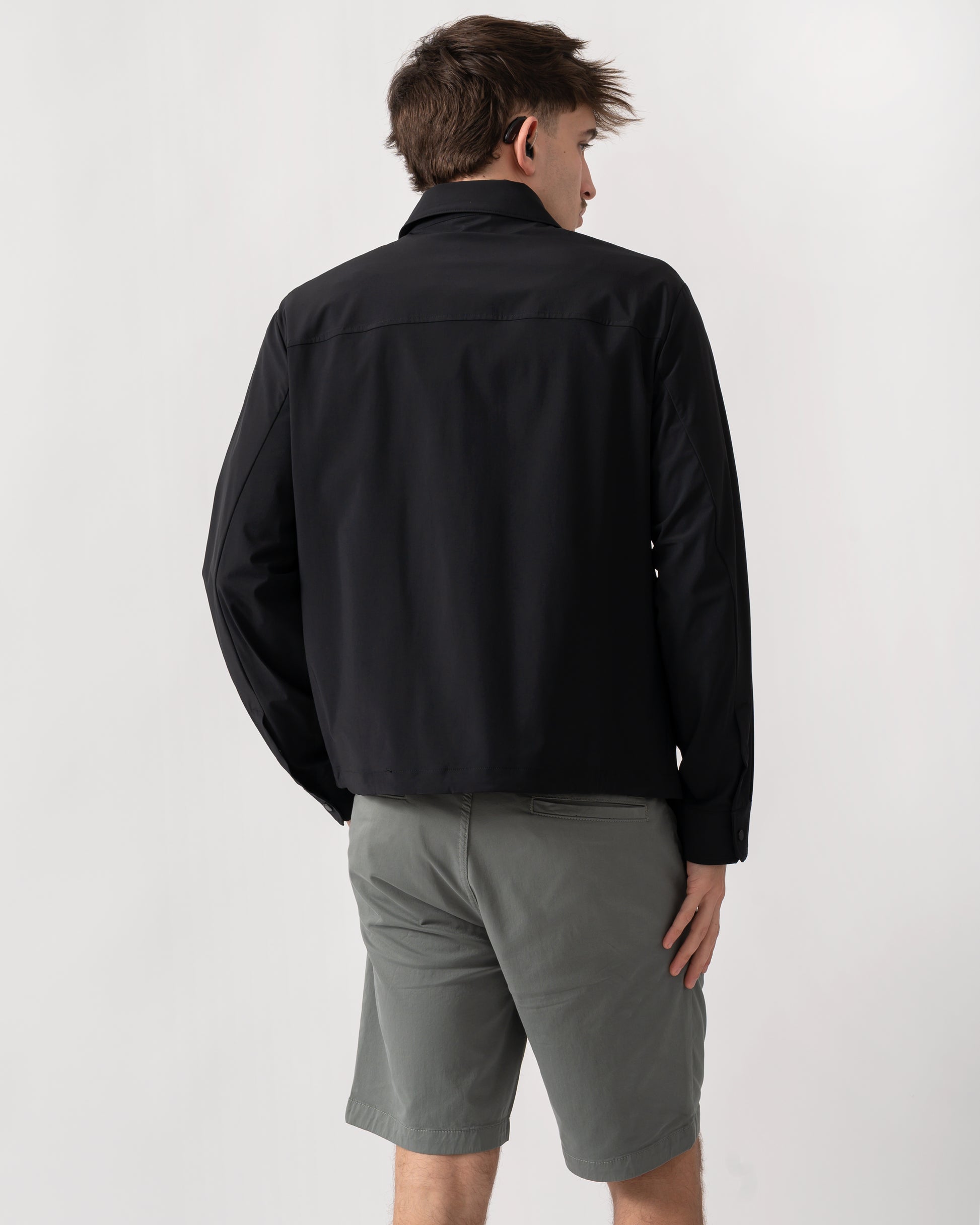 back shot of a model wearing an Armani Exchange Mens Jacket XM002818-AF22572 in Black UC001