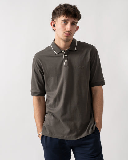 studio shot of a model wearing an Armani Exchange Mens Milano/New York Polo Shirt with Contrast Tipping in Chimera M8317