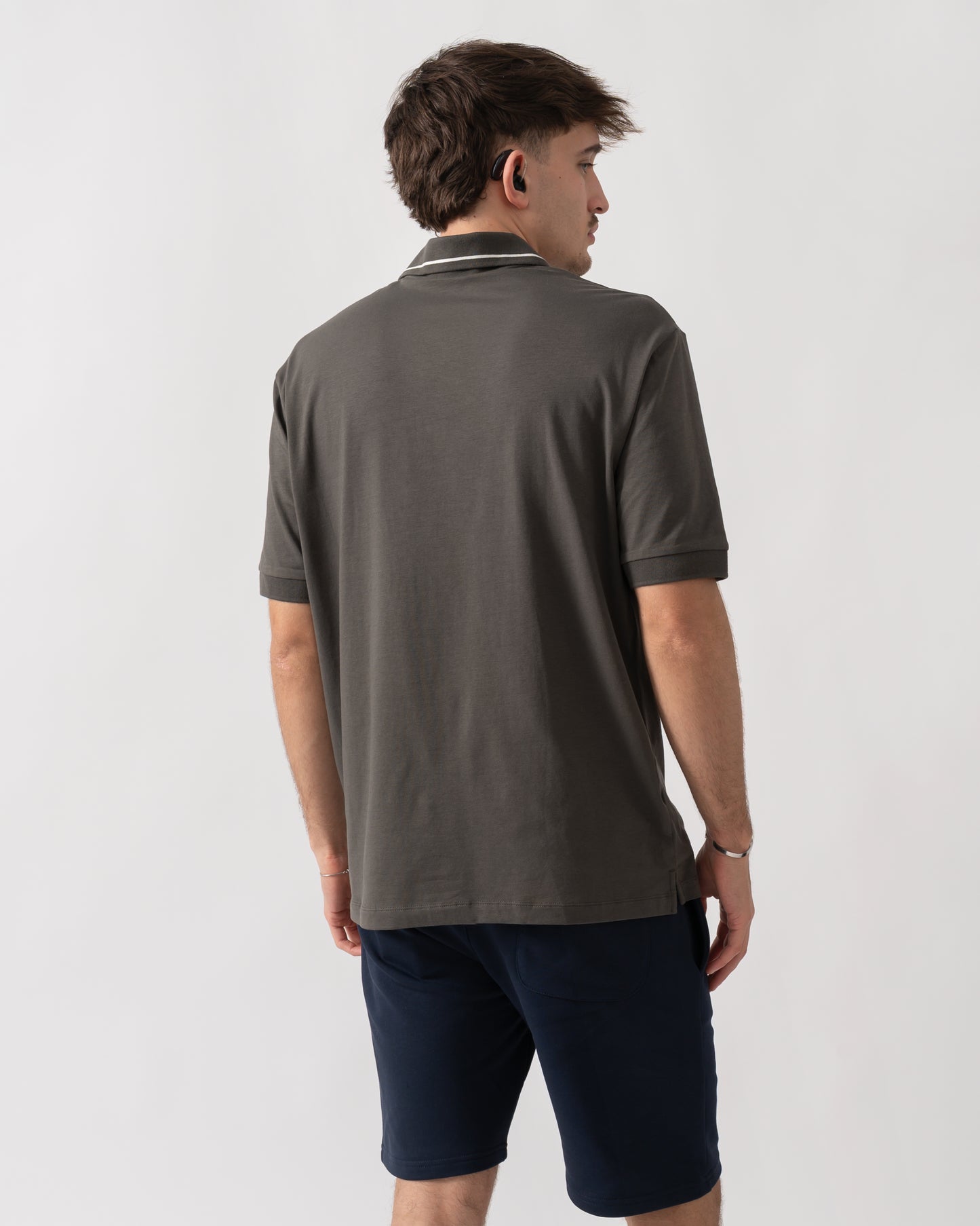 back shot of a model wearing an Armani Exchange Mens Milano/New York Polo Shirt with Contrast Tipping in Chimera M8317