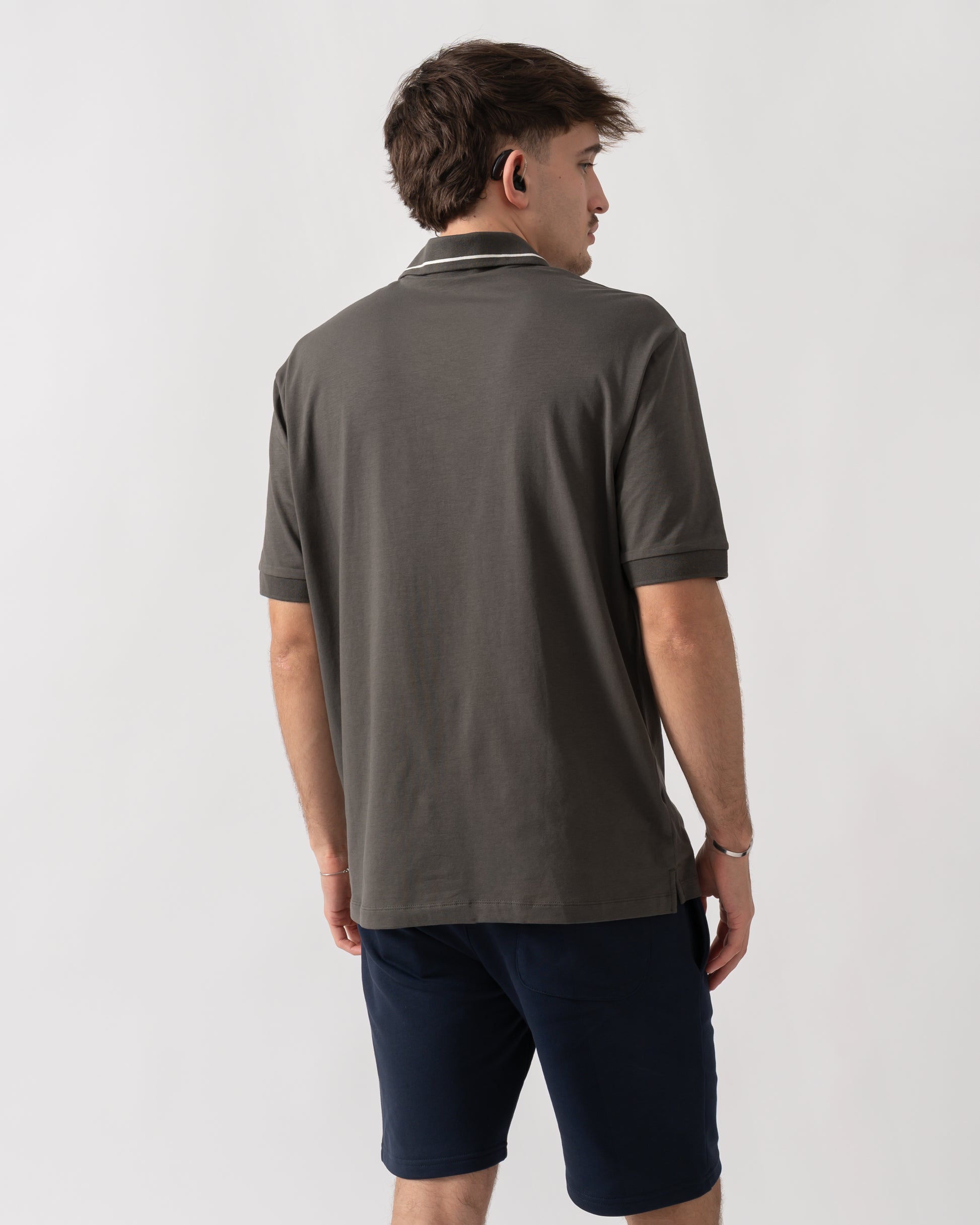 back shot of a model wearing an Armani Exchange Mens Milano/New York Polo Shirt with Contrast Tipping in Chimera M8317